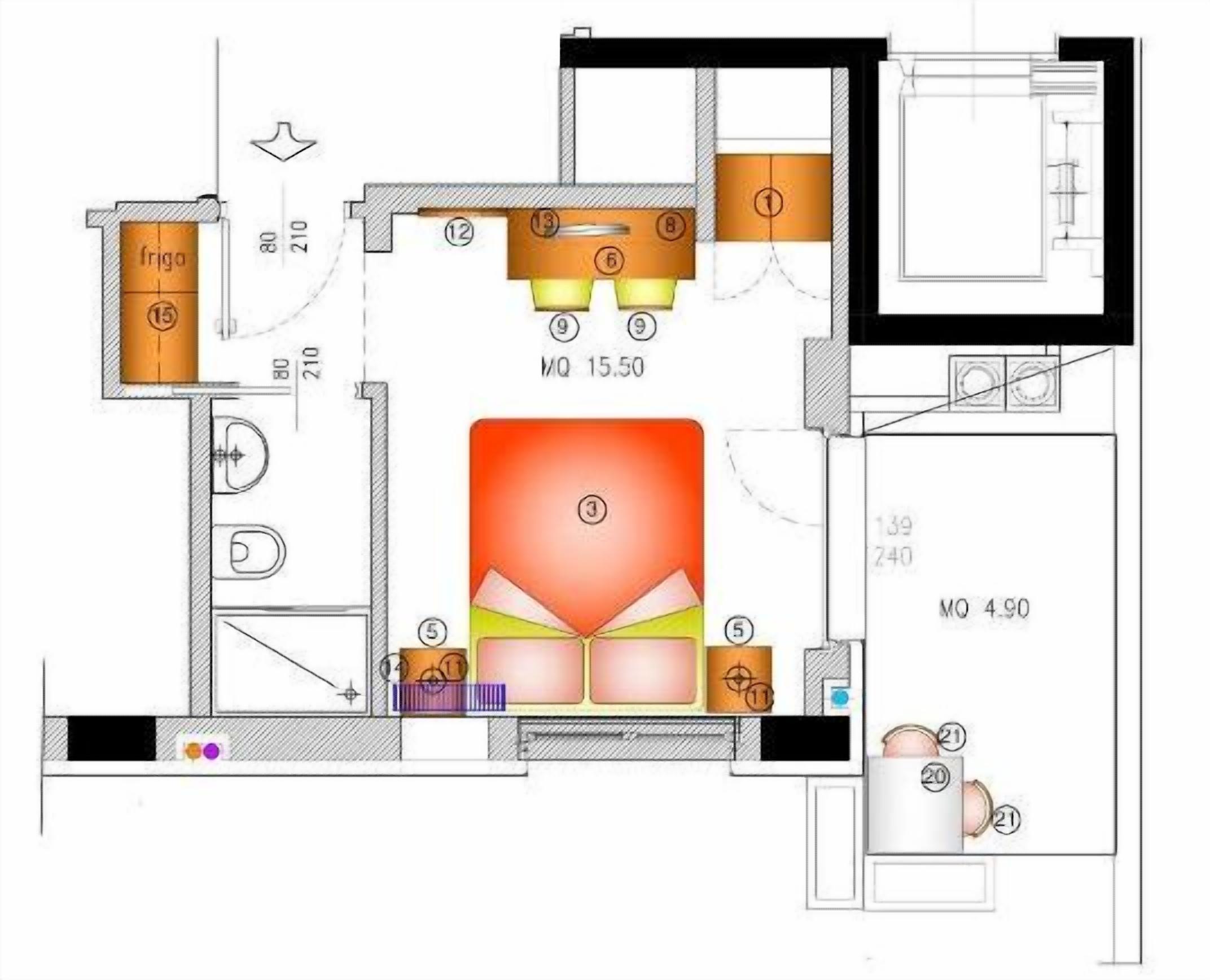 Plano de planta que muestra una cocina, comedor y dos dormitorios.