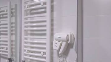 Hair dryer, slippers, towels, soap