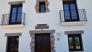 A building with a sign reading "Casa Rural Mirador de los Tomillos" and a number "24" above the door. - Casa Rural Mirador de los Tomillos (Cardena)