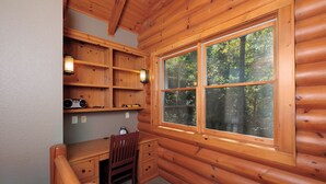 A log cabin room with a desk, chair, shelves, and a large window. - Peaceful Paradise secluded mountain log cabin with scenic view and game room (Whittier)