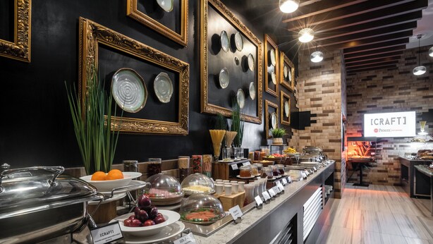 A buffet area with various food items and a sign indicating 'CRAFTI'. - Best Western Premier Westlands (Nairobi)