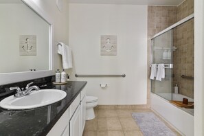 Combined shower/tub, hair dryer, towels, soap