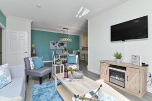 Smart TV, fireplace, books, stereo
