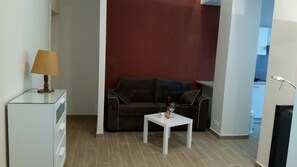 Deluxe-Apartment | Wohnbereich | Flachbildfernseher