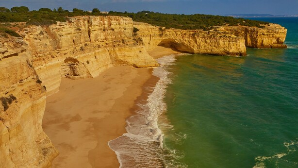 A coastal cliff with a beach and clear turquoise waters. - Gorgeous villa ideally located with pool, ocean views, AirCo, great for families (Carvoeiro)