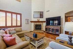 Smart TV, fireplace, table football, books