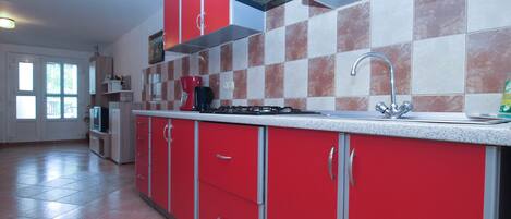 Fridge, stovetop, coffee/tea maker, cookware/dishes/utensils