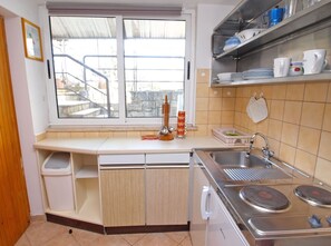 Fridge, stovetop, cookware/dishes/utensils