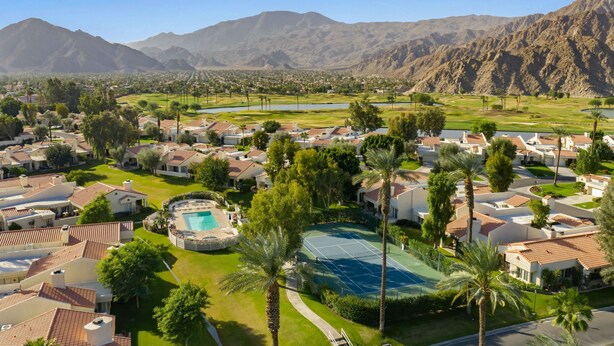 A residential area with houses, a tennis court, and a swimming pool. - Santa Rosa Cove #14 Mtn. Views, 2 bed/2 bath Pet friendly Home, Permit 068343 (La Quinta)