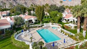 A resort with a swimming pool, white fences, and palm trees. - Santa Rosa Cove #42, 3 BD /3.5 BA, Pet Friendly Home, Permit 063486 (La Quinta)