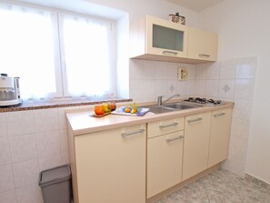 Fridge, stovetop, coffee/tea maker, cookware/dishes/utensils