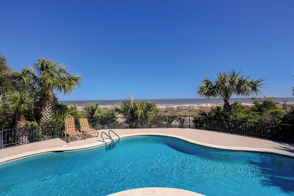 A swimming pool with a view of the ocean.