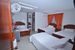 Standard Quadruple Room | Minibar, in-room safe, free WiFi, bed sheets - Hotel Grand Latino Ibague (Ibagué)