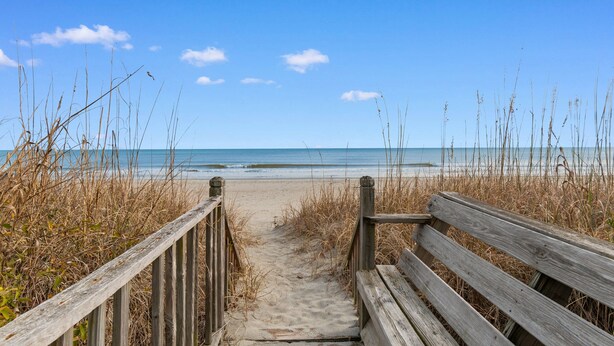 A wooden pathway leading to a beach with a wooden bench. - 5BR House with Private Pool Near Surfside Pier (Surfside Beach)