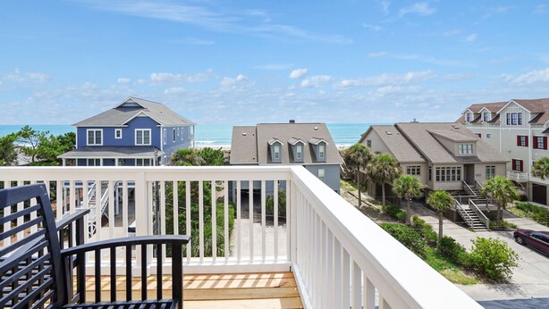 A balcony with a view of the ocean and neighboring houses. - Ocean View 6-Bedroom Beach Haven Sleeps 17 Near North Litchfield (North Litchfield)