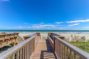 A wooden boardwalk leading to a beach with clear skies. - 8BR Family Home w/ Pool & Beach Access Near Surfside Pier (Surfside Beach)