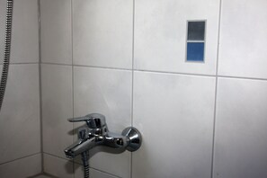 Bathtub, hair dryer, towels, soap