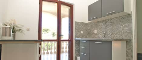 Fridge, stovetop, coffee/tea maker, cookware/dishes/utensils