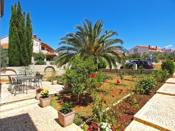 Enjoy a peaceful outdoor space with a beautifully maintained garden, patio, and serene surroundings.
