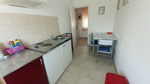 Fridge, stovetop, cookware/dishes/utensils