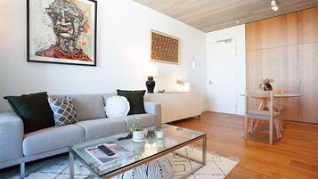 One Bedroom Apartment | Living room | 49-inch Smart TV with digital channels, TV