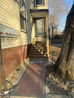 Stunning suburban home with a charming entrance and inviting front door.