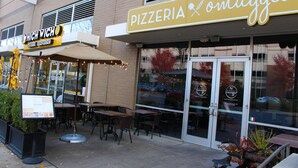 A pizzeria with outdoor seating and a menu board. - Modern & Stylish 1BR ◈ Great Location ◈ Walkable (Charlotte)