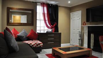 Apartment, 2 Bedrooms | Living room | Flat-screen TV