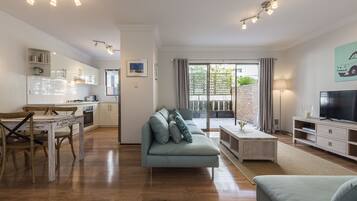 Executive Apartment | Living area | TV