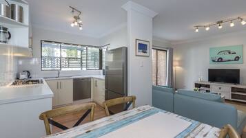 Executive Apartment | Living area | TV