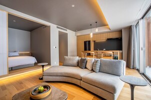 1 Bedroom Suite | Living room | Flat-screen TV