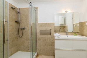 Shower, towels, toilet paper