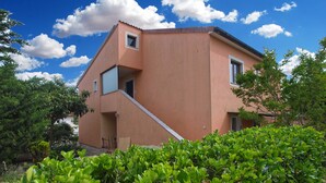 A modern building with a sloped roof, a small balcony, and a window. - Apartment 1676/17366 (Istria - Banjole), 1000m from the beach (Banjole)
