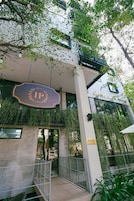 A building with a sign reading "Blossom Park Hotel."