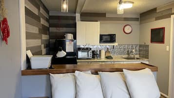 Coffee/tea maker, toaster, high chair, cookware/dishes/utensils