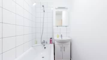 Apartment, 2 Bedrooms | Bathroom | Combined shower/bathtub, hair dryer, towels, soap