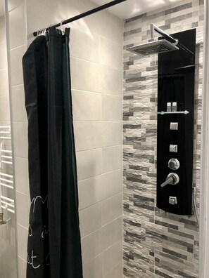 Shower, free toiletries, hair dryer, slippers