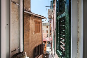 Stroll through a charming, historic neighborhood, lined with traditional buildings and quaint courtyards.