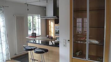 Standard Apartment, 3 Bedrooms | Private kitchen | High chair, cookware/dishes/utensils