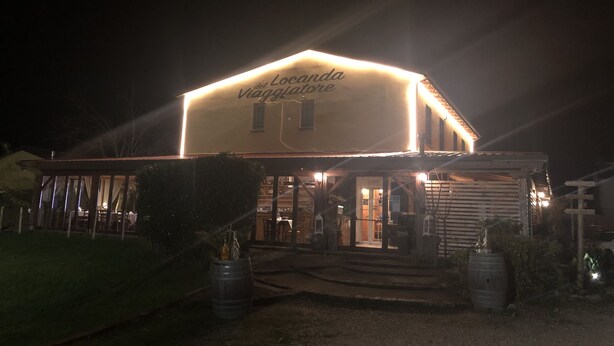 A building with a sign reading "Locanda del Viaggiatore" at night. - Osteria e Locanda del Viaggiatore (Russi)