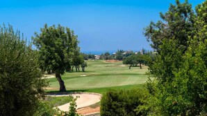 A golf course with a clear view of the ocean and surrounding trees. - Villa 148 Lofou - Four Bedroom Villa, Sleeps 8 (Kouklia)