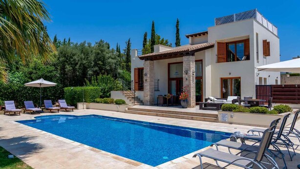 A modern house with a swimming pool, outdoor seating, and a garden. - Villa 148 Lofou - Four Bedroom Villa, Sleeps 8 (Kouklia)