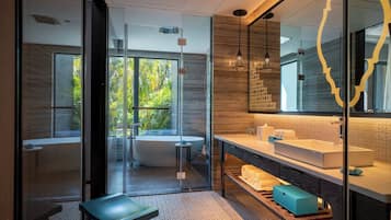 Separate tub and shower, rainfall showerhead, free toiletries