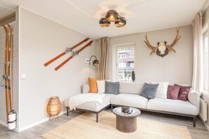 Premium Apartment | Living area | Flat-screen TV, heated floors