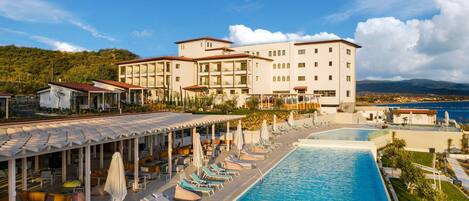 Seasonal outdoor pool, pool umbrellas, pool loungers
