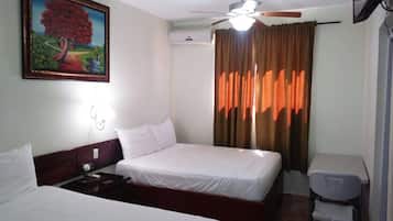 Habitación doble, 2 camas Queen size | Cortinas blackout, wifi gratis y ropa de cama