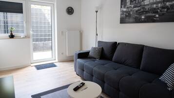 Classic Apartment | Living area | 40-inch Smart TV with cable channels, TV