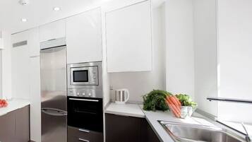 Fridge, electric kettle, toaster, dining tables