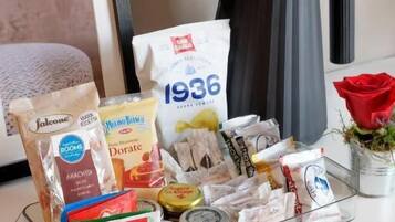 A kitchen counter with various food items and kitchenware.