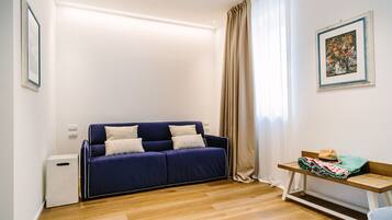 Junior Suite, Sea View | Living room | 49-inch LCD TV with satellite channels, TV